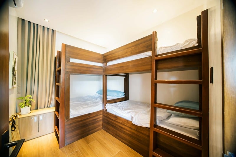 Room 2 — solid wood double bunk beds sleeping up to eight guests